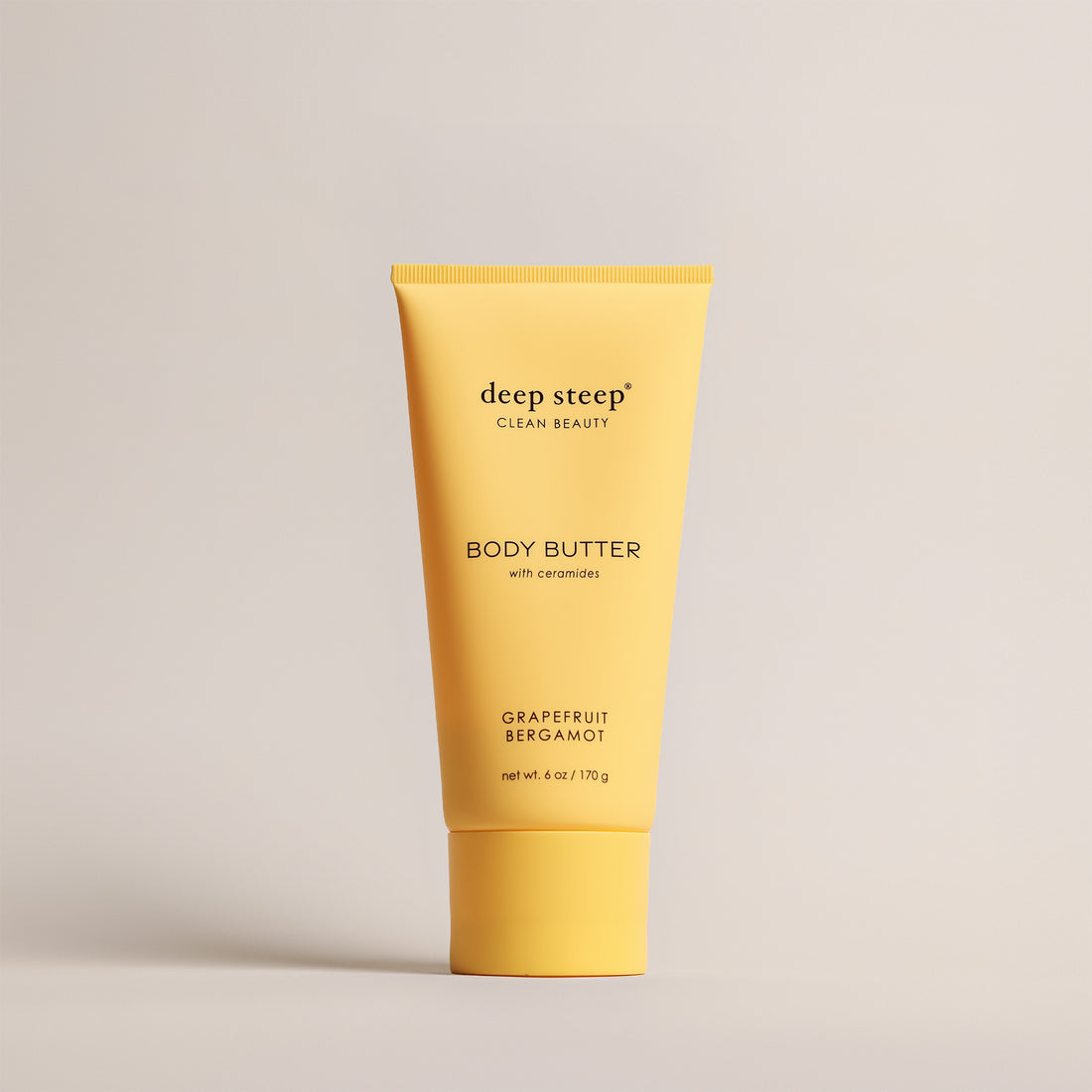Deep Steep Grapefruit Bergamot Body Butter, 6 oz tube, featuring ceramides on a beige background