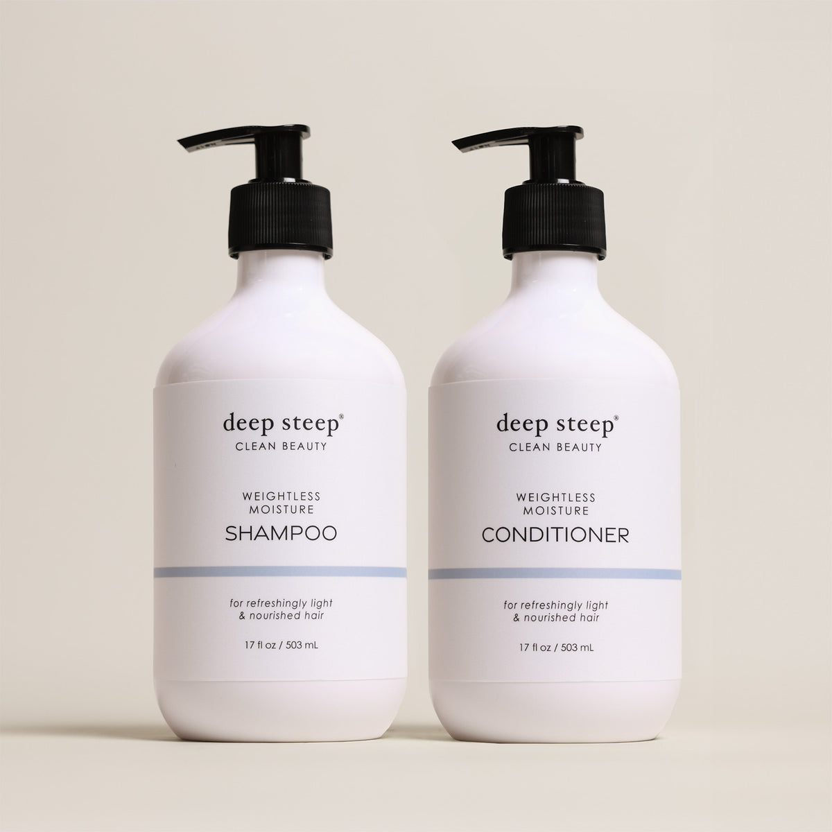 Two bottles of Deep Steep Weightless Moisture Shampoo and Conditioner, 17 fl oz bottles with pumps, on a beige background