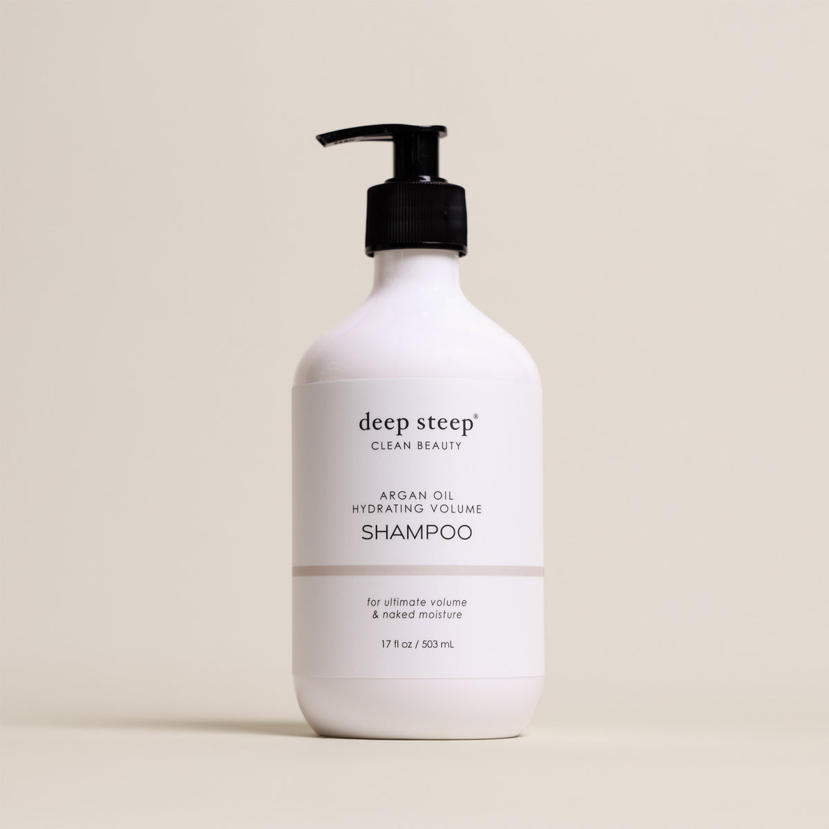 Deep Steep Argan Oil Hydrating Volume Shampoo, 17 fl oz bottle with a pump, on a beige background