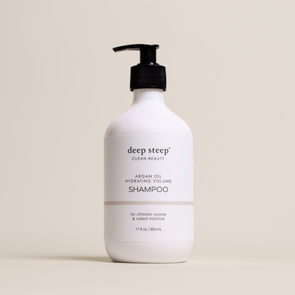 Deep Steep Argan Oil Hydrating Volume Shampoo, 17 fl oz bottle with a pump, on a beige background
