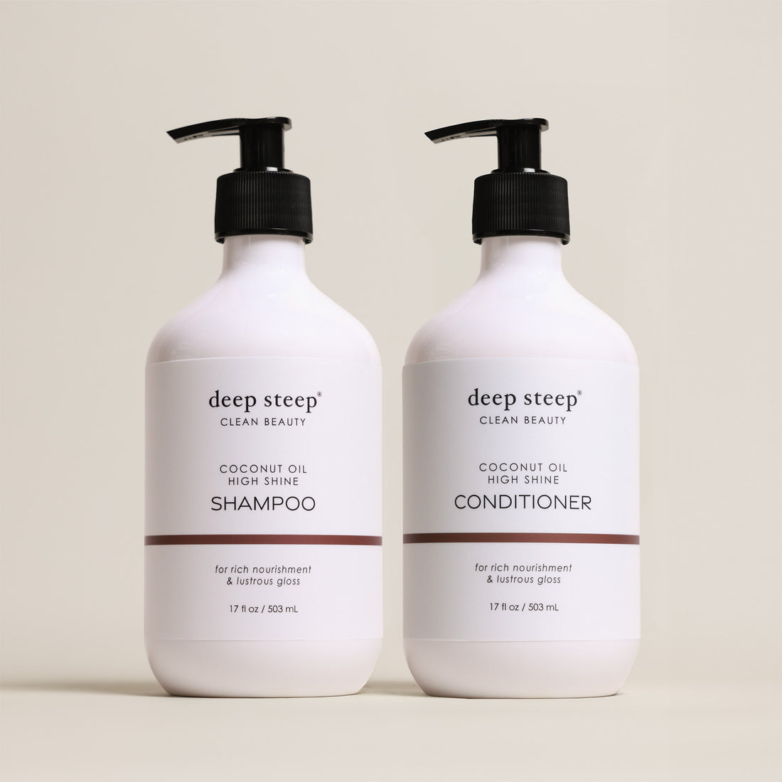 Two bottles of Deep Steep Coconut Oil High Shine Shampoo and Conditioner, 17 fl oz bottles with pumps, on a beige background