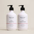Two bottles of Deep Steep Curl Defining Shampoo and Conditioner, 17 fl oz bottles with pumps, on a beige background