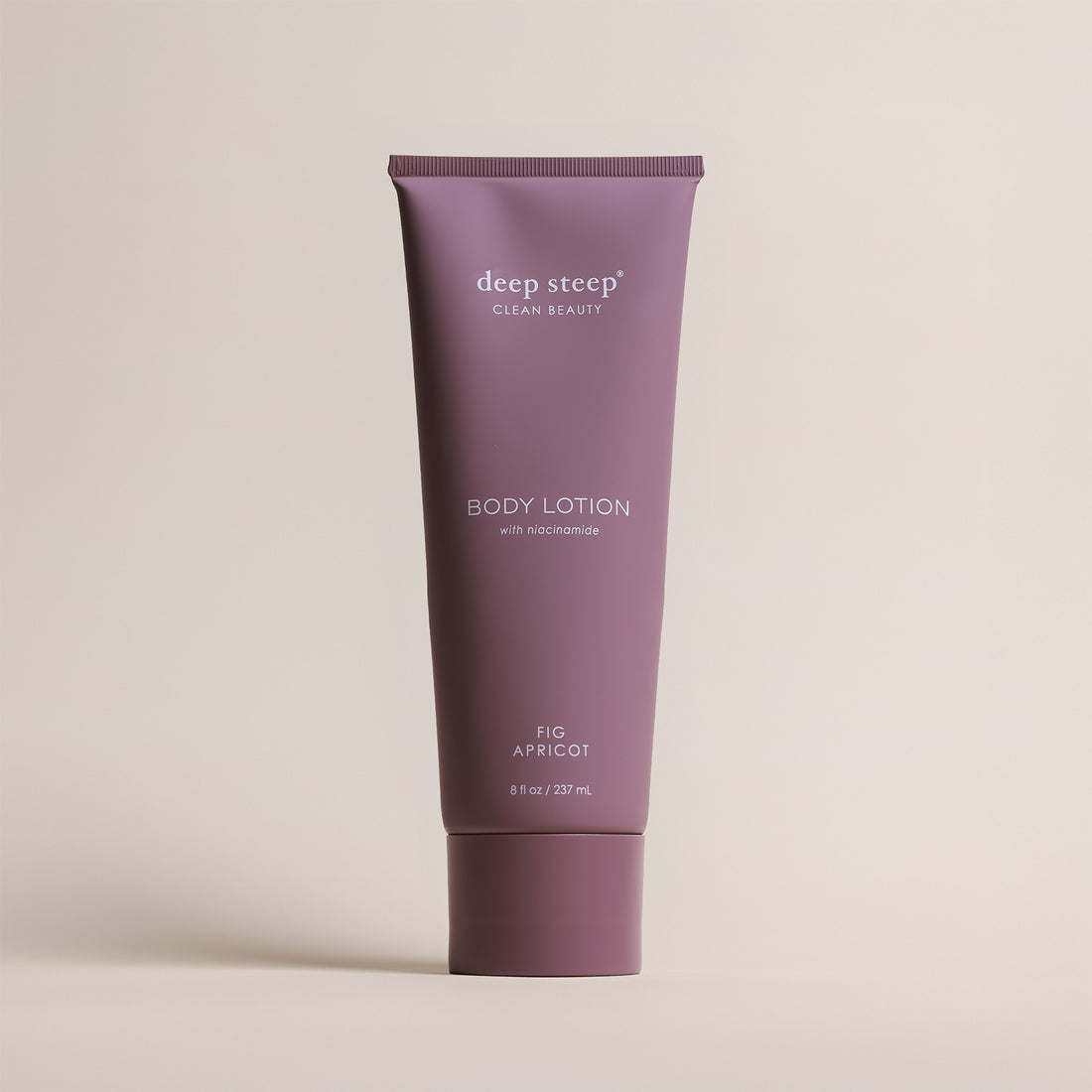Deep Steep Fig Apricot Body Lotion, 8 fl oz tube, featuring niacinamide on a beige background
