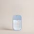 Front view of the Deep Steep Fragrance-Free Hydrating Mist pocket sanitizer spray in a light blue rectangular bottle with a clear front label against a solid beige background.