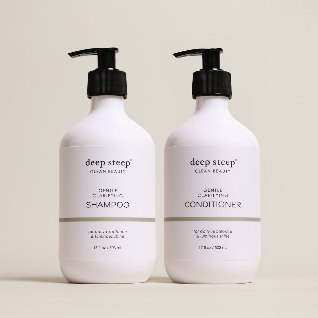Two bottles of Deep Steep Gentle Clarifying Shampoo and Conditioner, 17 fl oz bottles with pumps, on a beige background