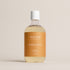 Deep Steep Honey Blossom Bubble Bath, 17 fl oz hypoallergenic bottle with a gold label on a neutral background