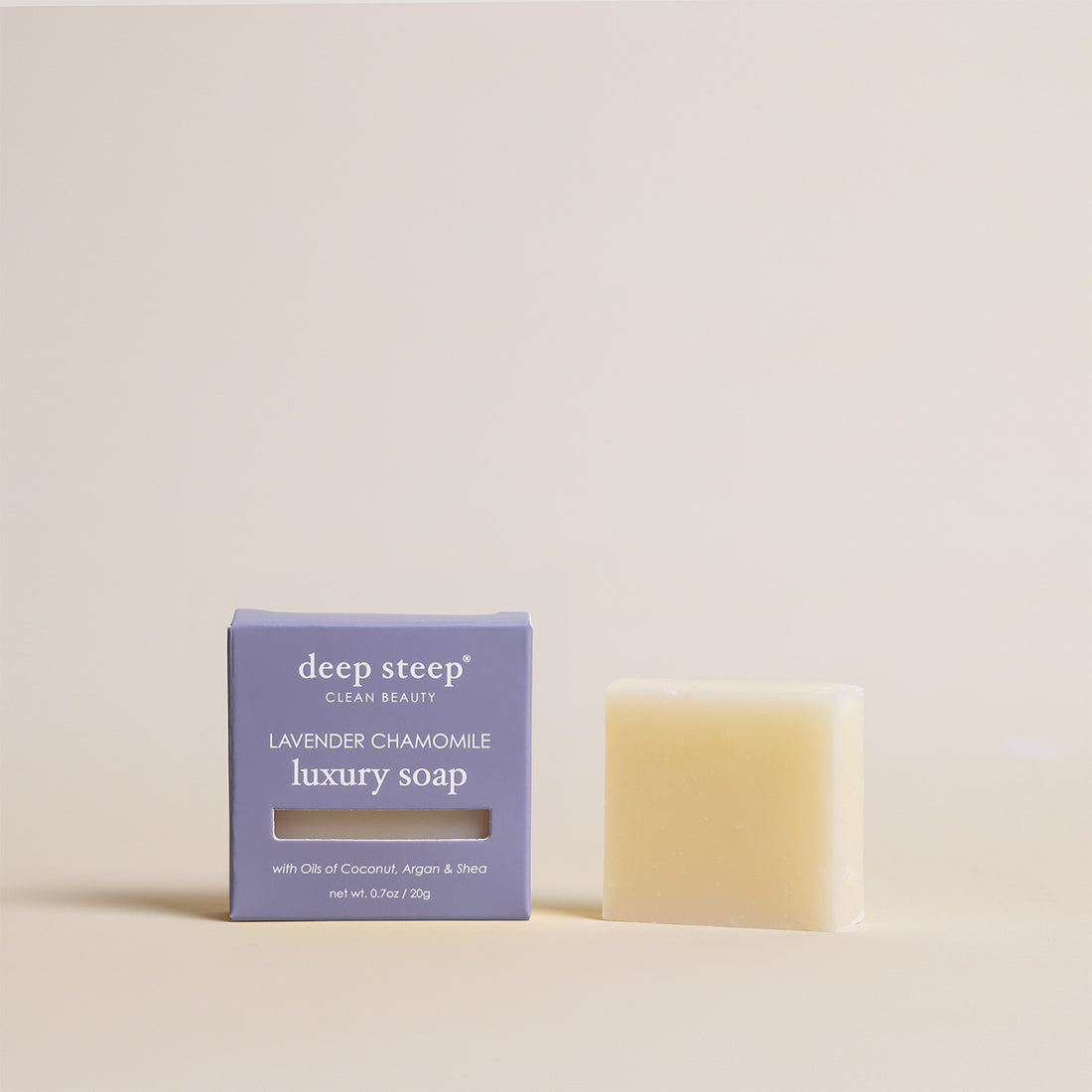 Deep Steep Lavender Chamomile luxury soap bar, 0.7 oz net weight, next to its packaging box made with coconut, argan, and shea oils