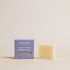 Deep Steep Lavender Chamomile luxury soap bar, 0.7 oz net weight, next to its packaging box made with coconut, argan, and shea oils