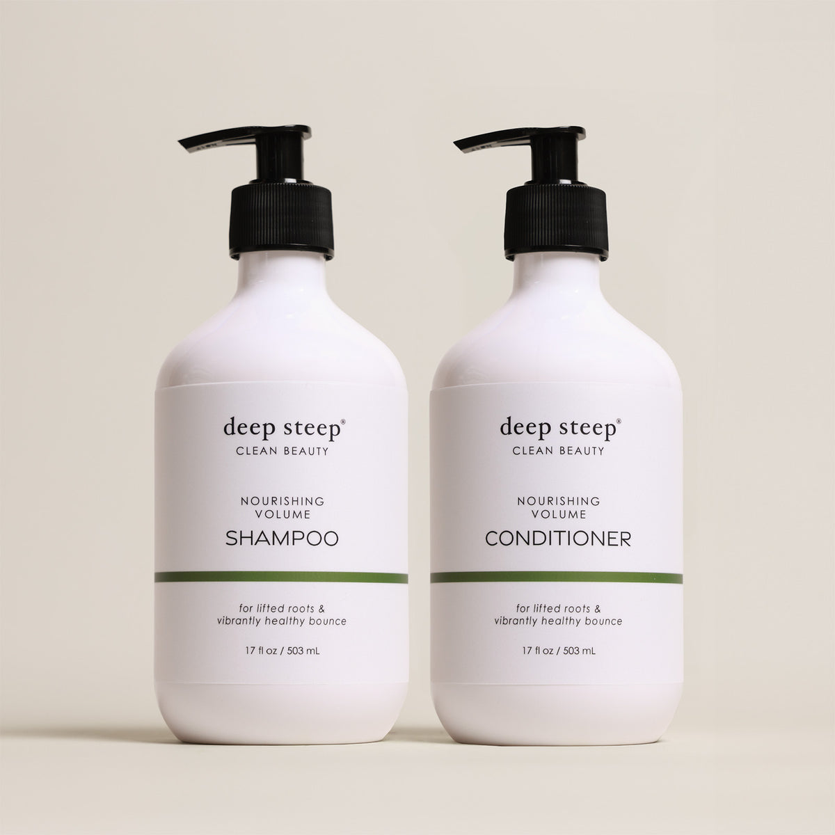 Two bottles of Deep Steep Nourishing Volume Shampoo and Conditioner, 17 fl oz bottles with pumps, on a beige background