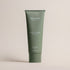 Deep Steep Rosemary Mint Body Lotion, 8 fl oz tube, featuring niacinamide on a beige background