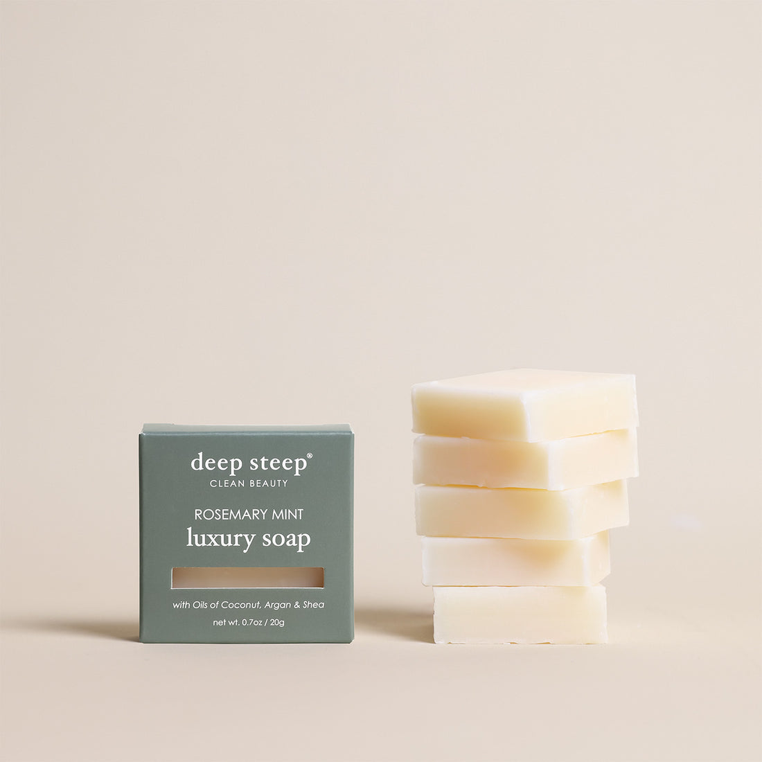 Deep Steep Rosemary Mint luxury soap bar, 0.7 oz net weight, next to its packaging box made with coconut, argan, and shea oils, 5 Pack
