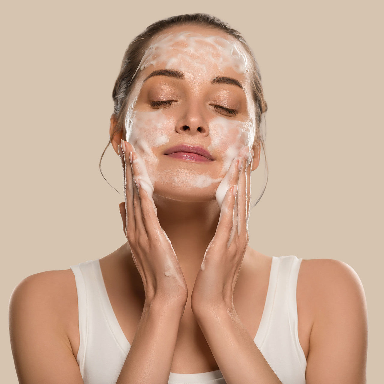Woman Washing Face with Deep Steep  Vitamin C Cleanser