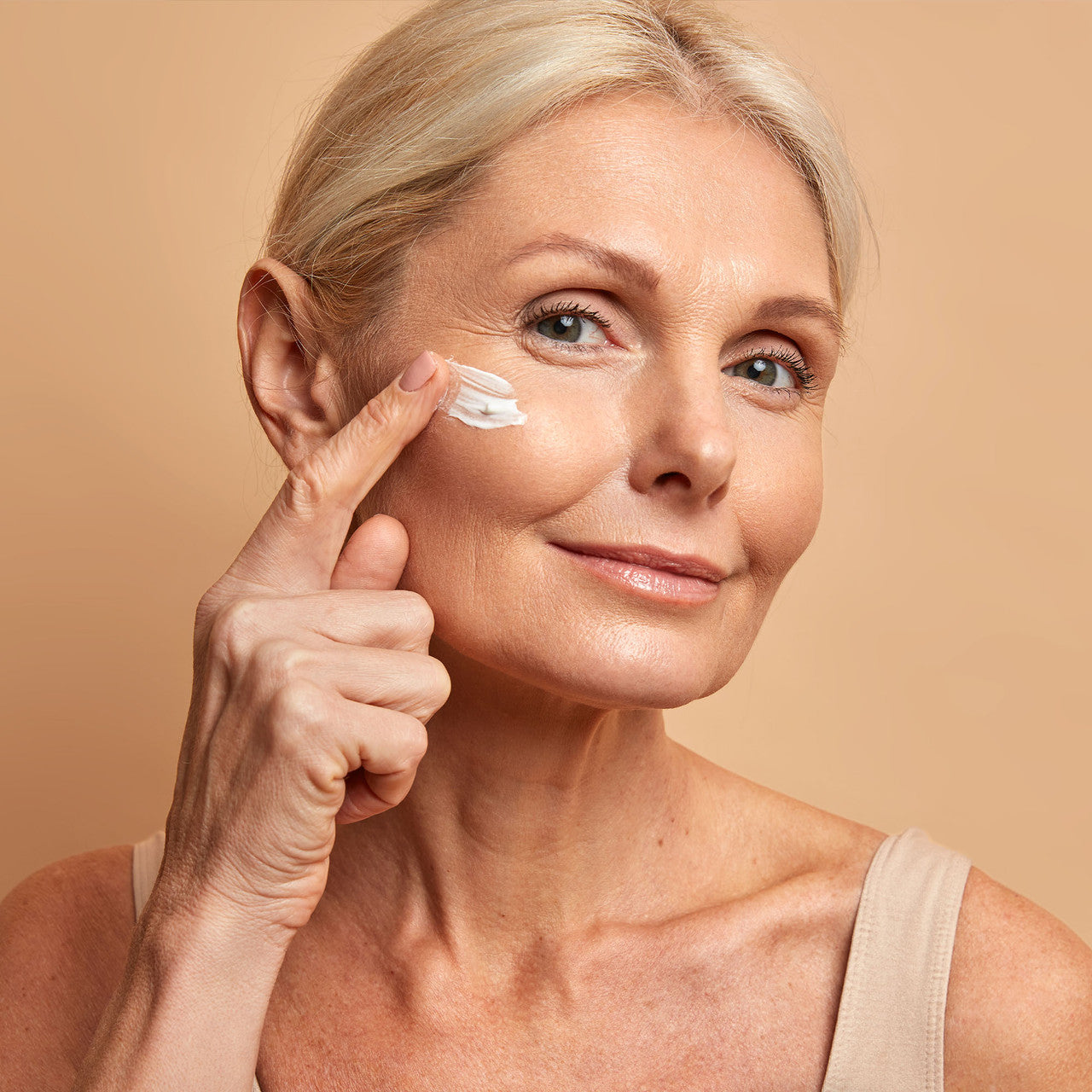 Woman Using Deep Steep Anti Aging Face Cream